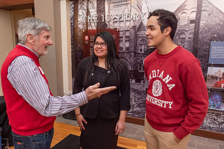 Two MacDonald Scholars speak with a mentor.